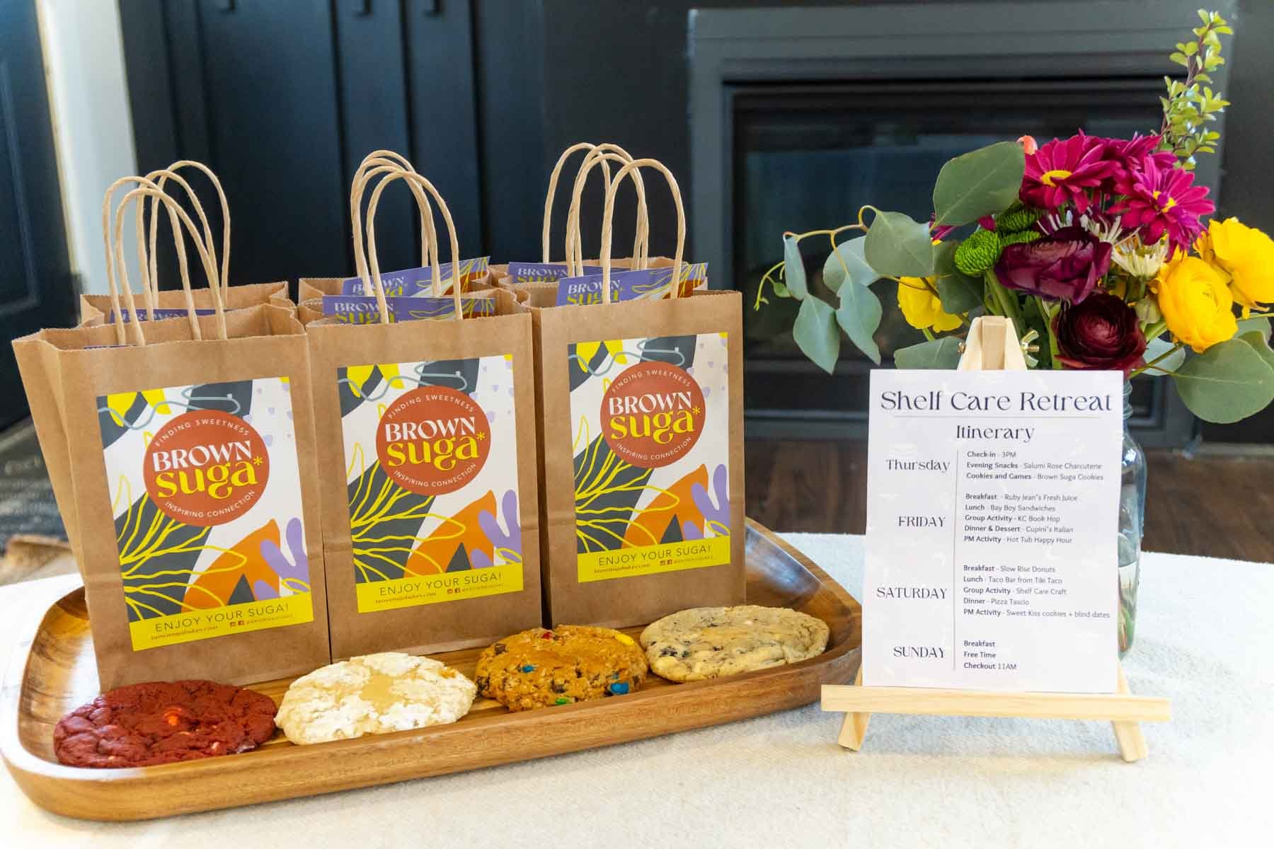 three Brown Suga bags with cookies on a tray