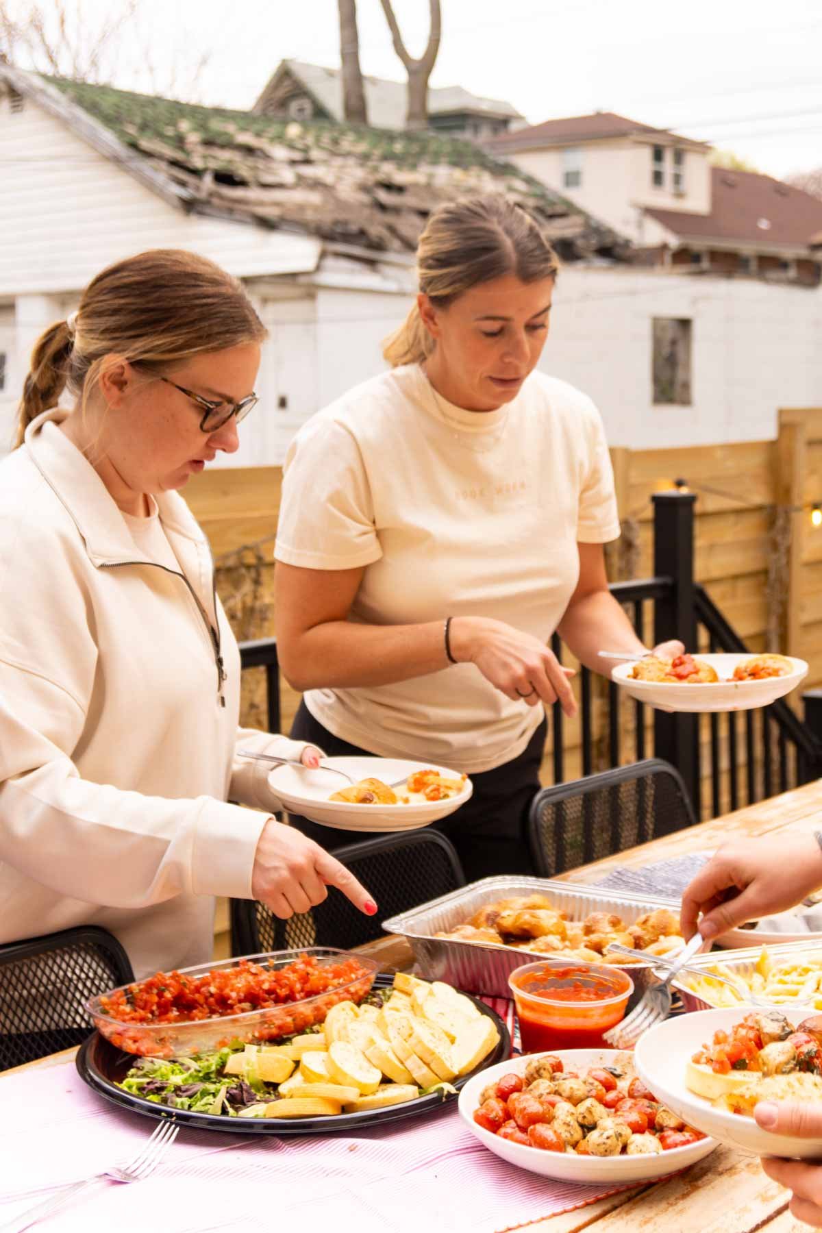 woman eating Italian food outdoors