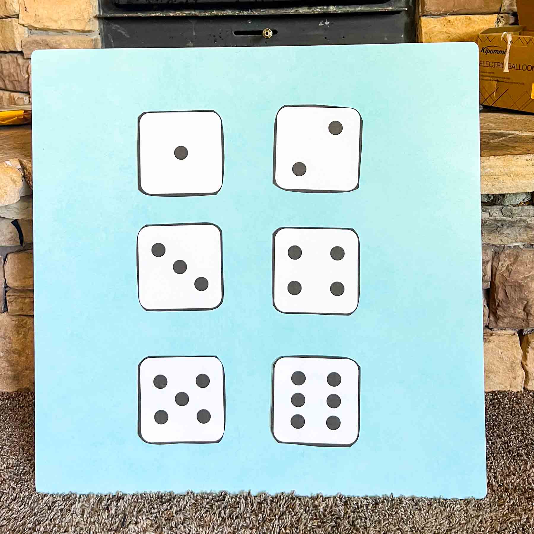 blue board with dice outline on it