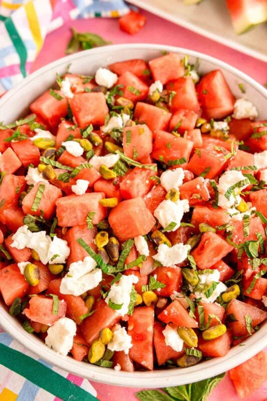 white bowl of watermelon mint salad that's a close up shot