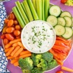 Greek yogurt veggie dip on a plate with veggies