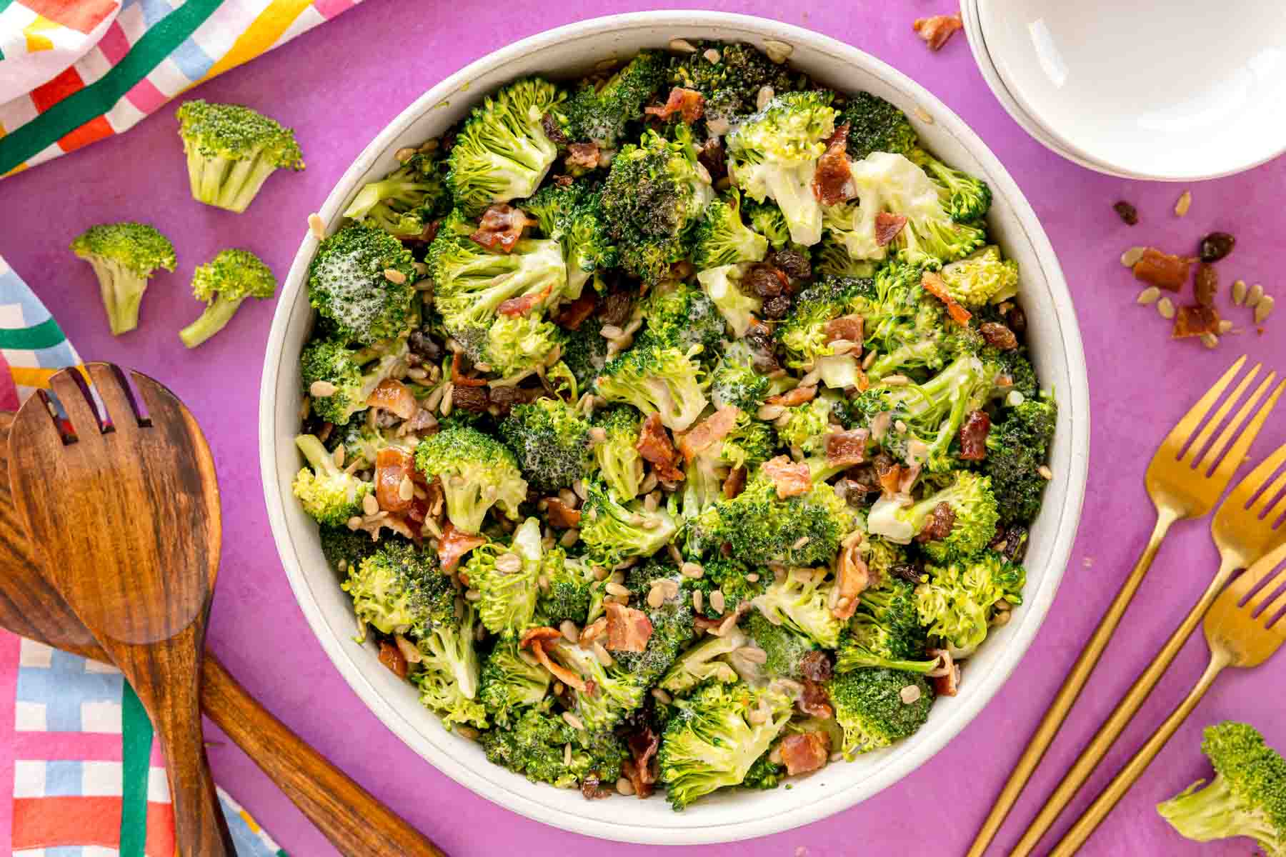 broccoli raisin salad in a white bowl