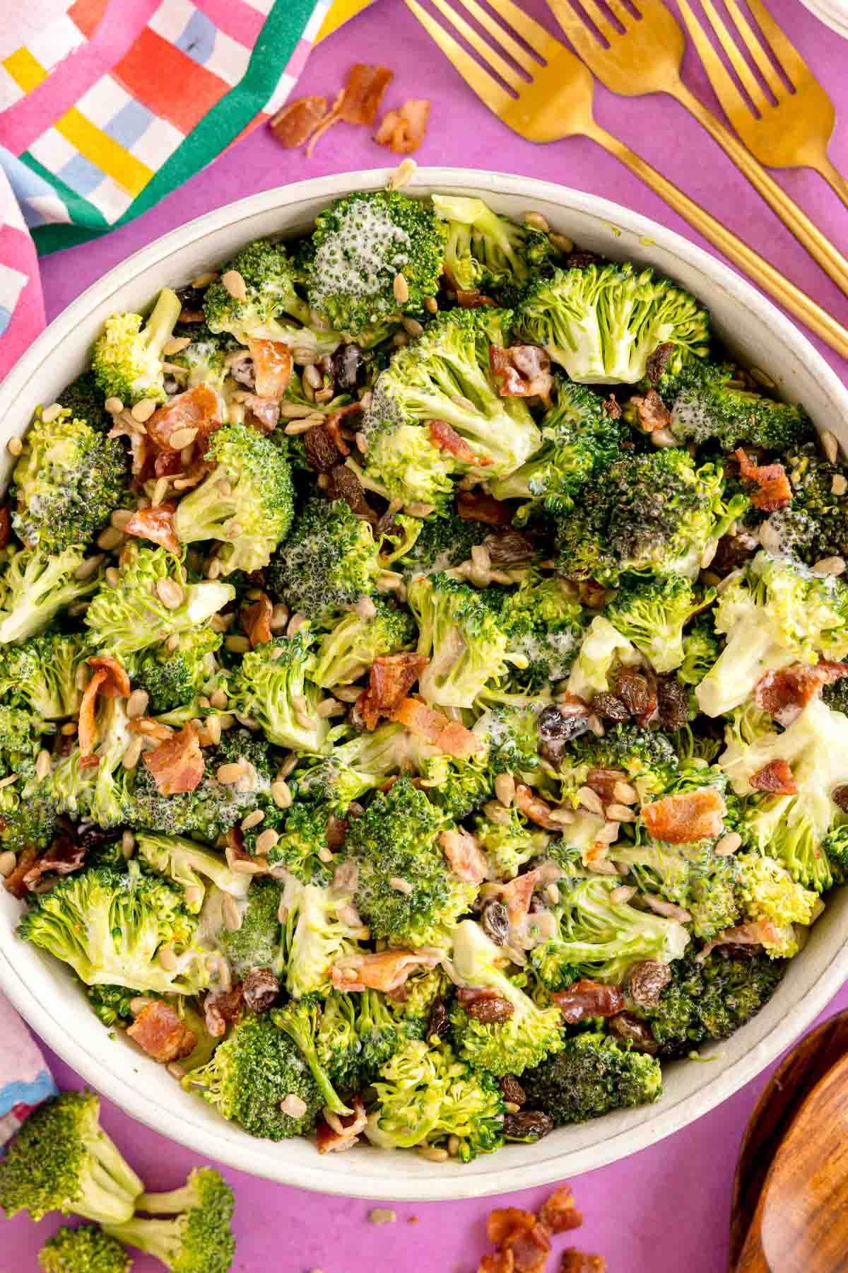 broccoli raisin salad in a white bowl