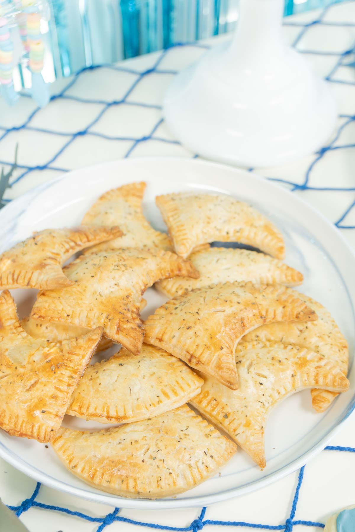 shark fin hand pies on a white plate