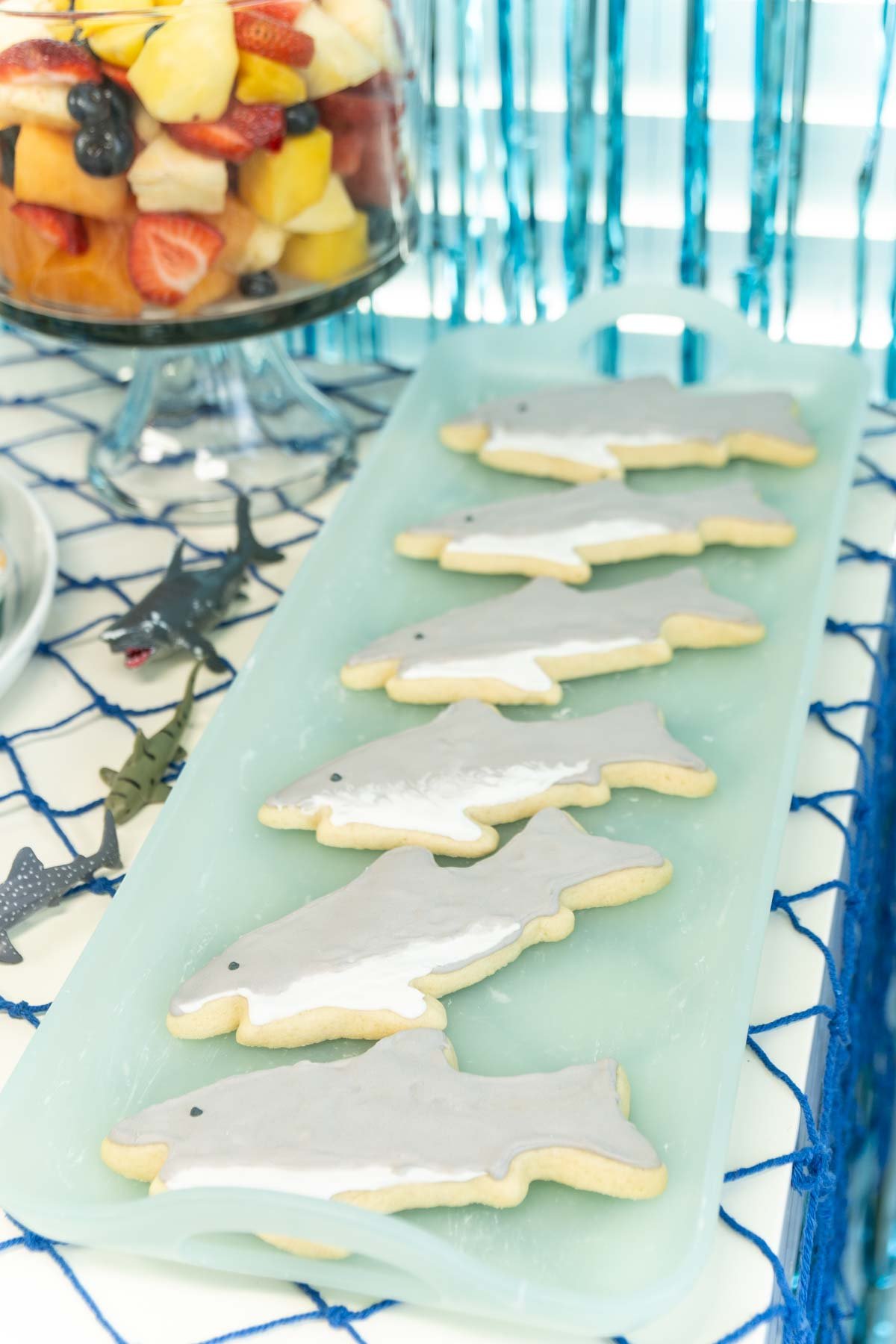 Shark cookies on a turquoise plate 