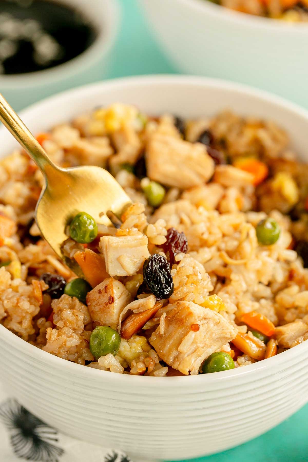 white bowl with chicken fried rice with rotisserie chicken