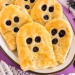 ghost shaped blueberry strudels on a white plate