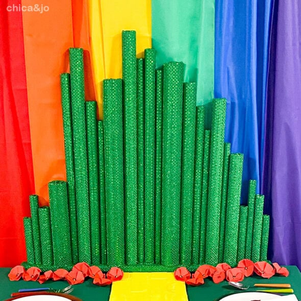 green decorated pool noodles that look like varying buildings