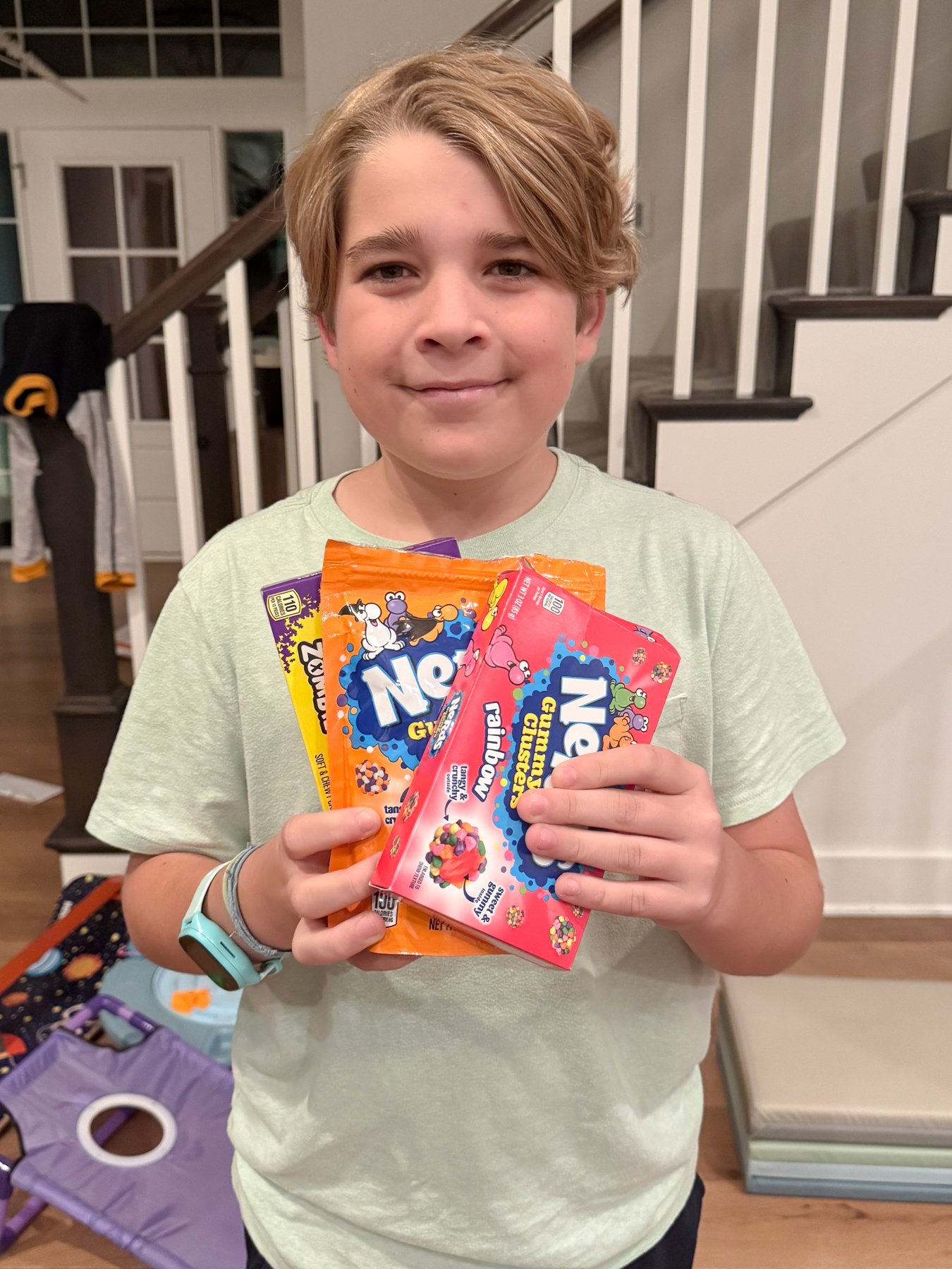 tween boy holding candy
