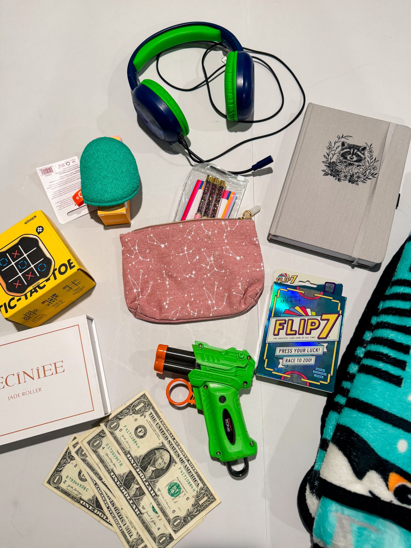 a bunch of random gift exchange prizes on a card table