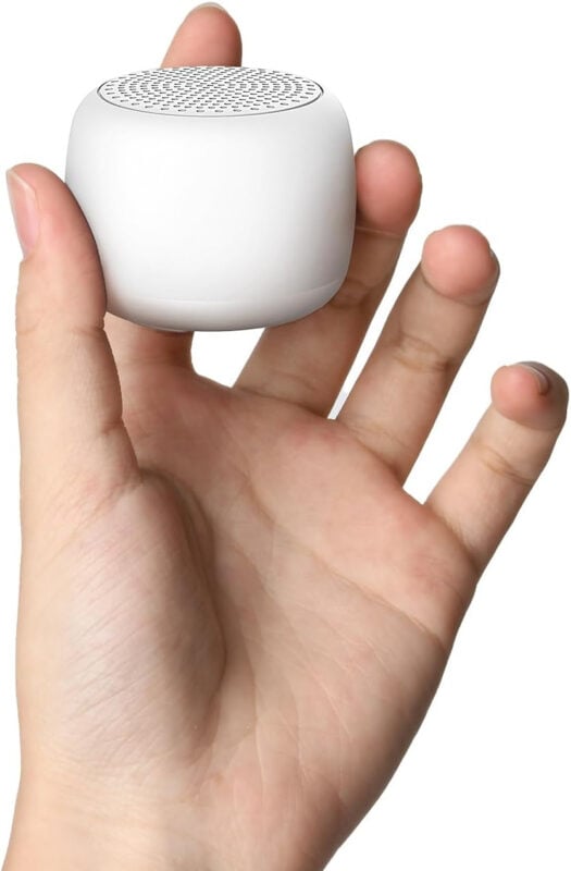 hand holding mini white noise machine