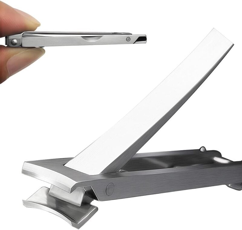 travel toe nail clippers being held in a man's hand