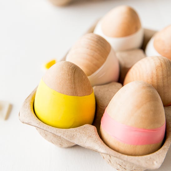wooden easter egg with balloon covering parts of the egg in a color blocking effect