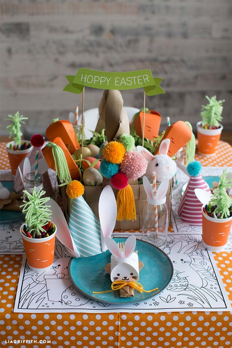 kids' table setting with paper basket in the center and cups of crayons