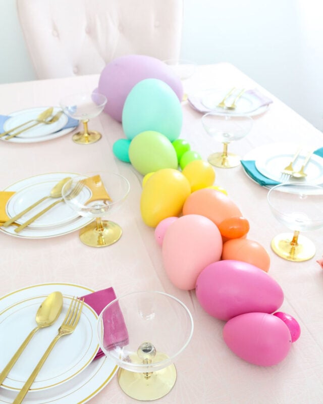 various sized and colored easter eggs used as an easter table center piece