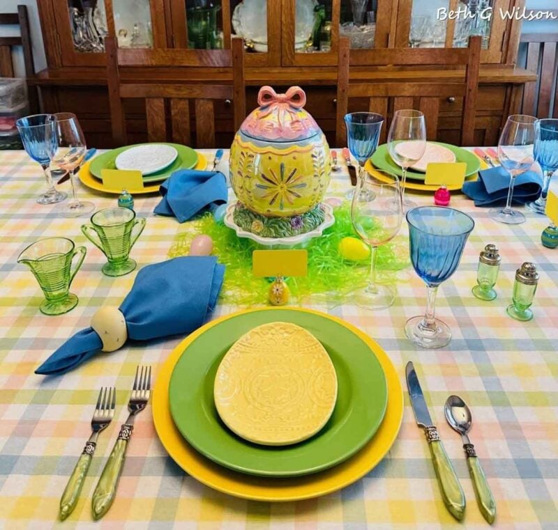 colorful easter table with easter egg shaped plates
