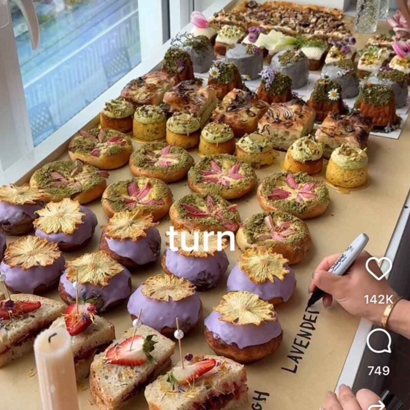 cafe table full of garden themed bakery items