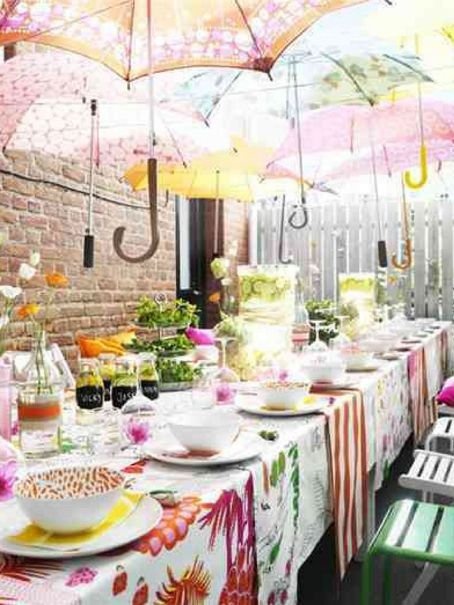 party table with umbrellas hung above them