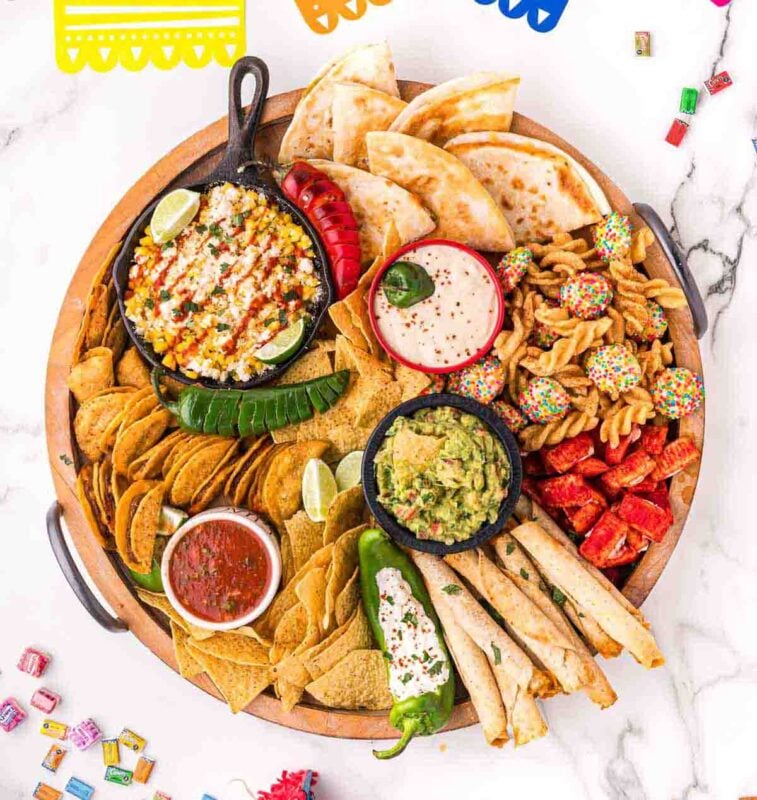 Charcuterie board filled with mexican food