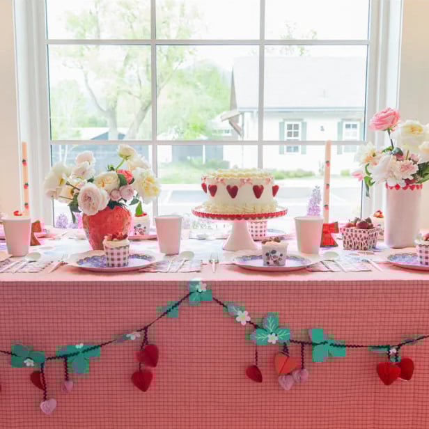 strawberry themed dessert table setting