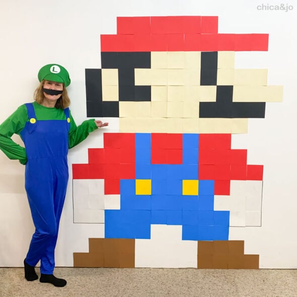 mario made out of pieces of paper on the wall