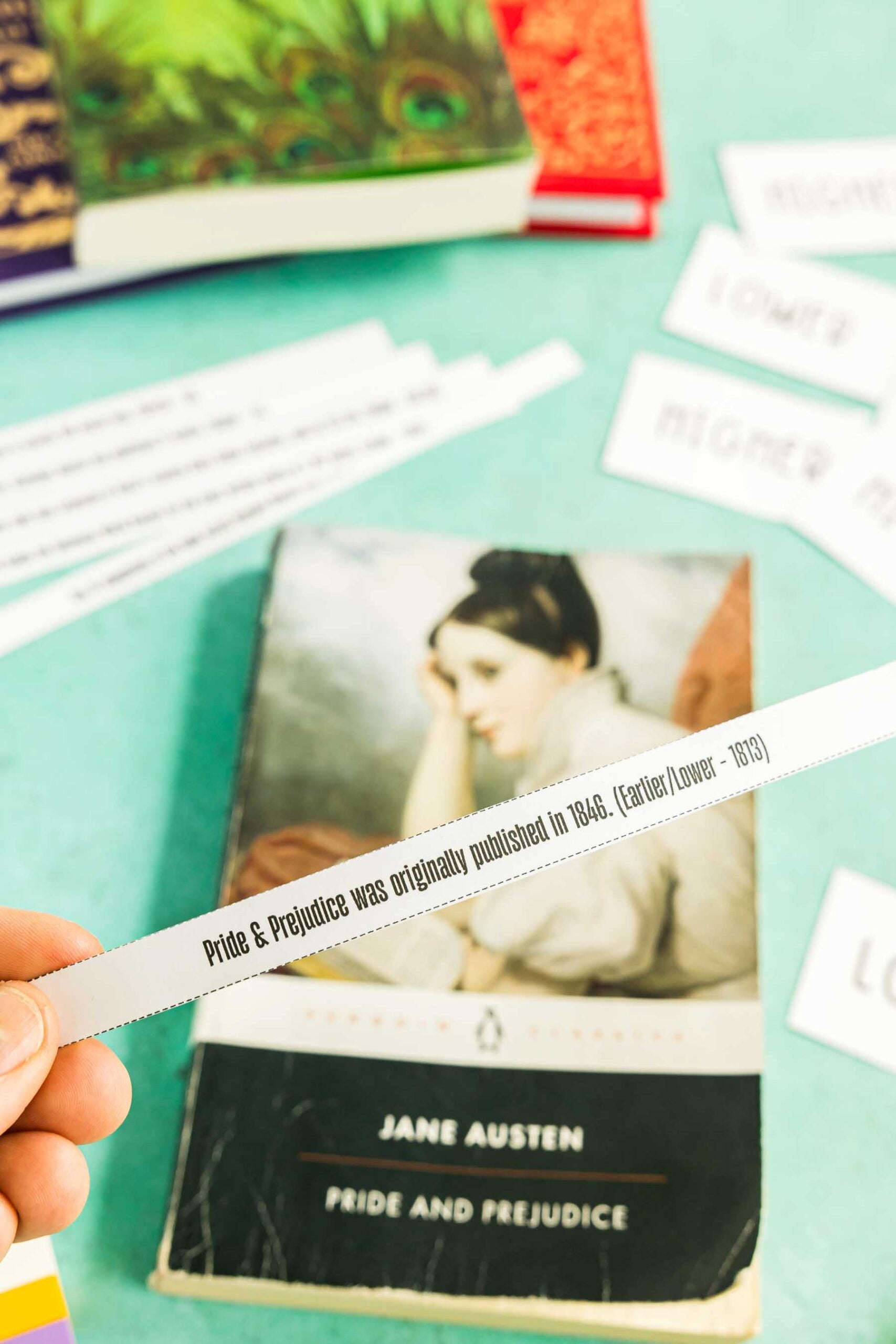 hand holding a higher or lower statement about books