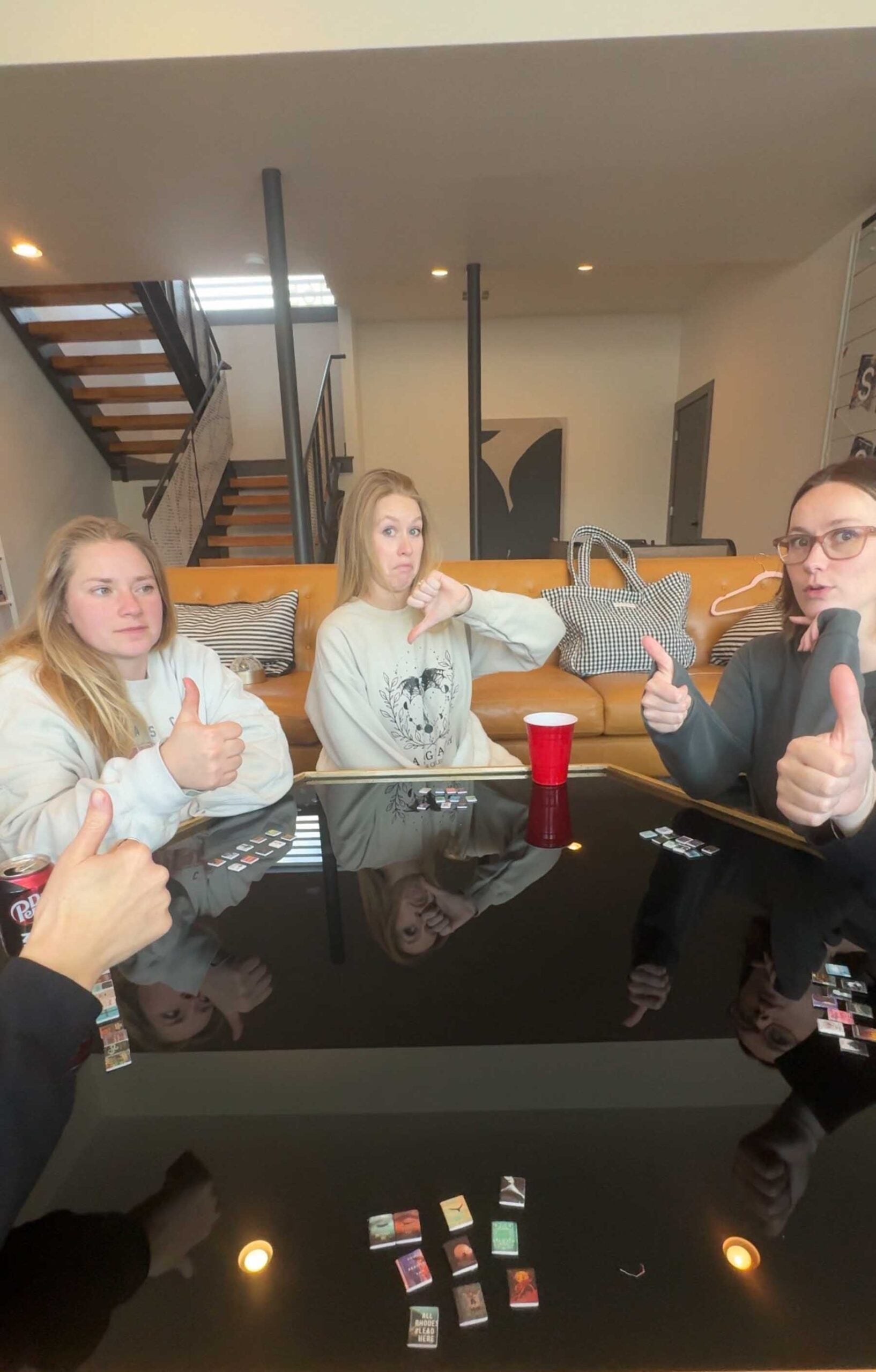 woman sitting around a table with mini books