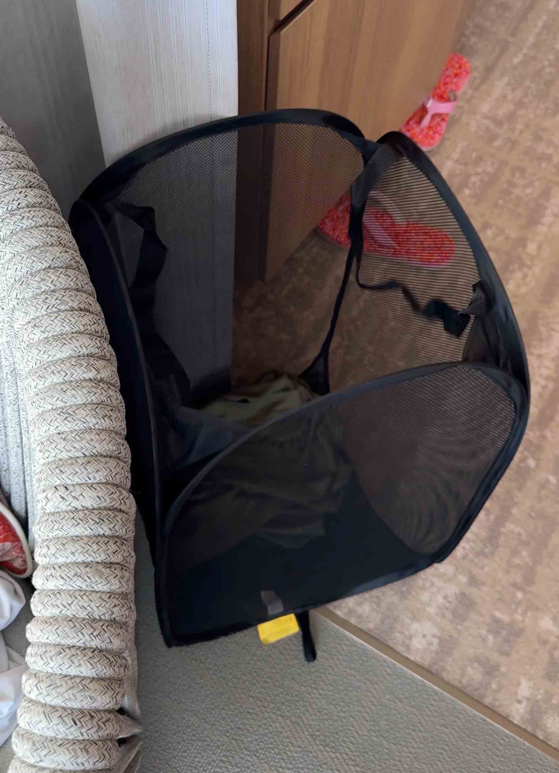 laundry hamper with clothes in it