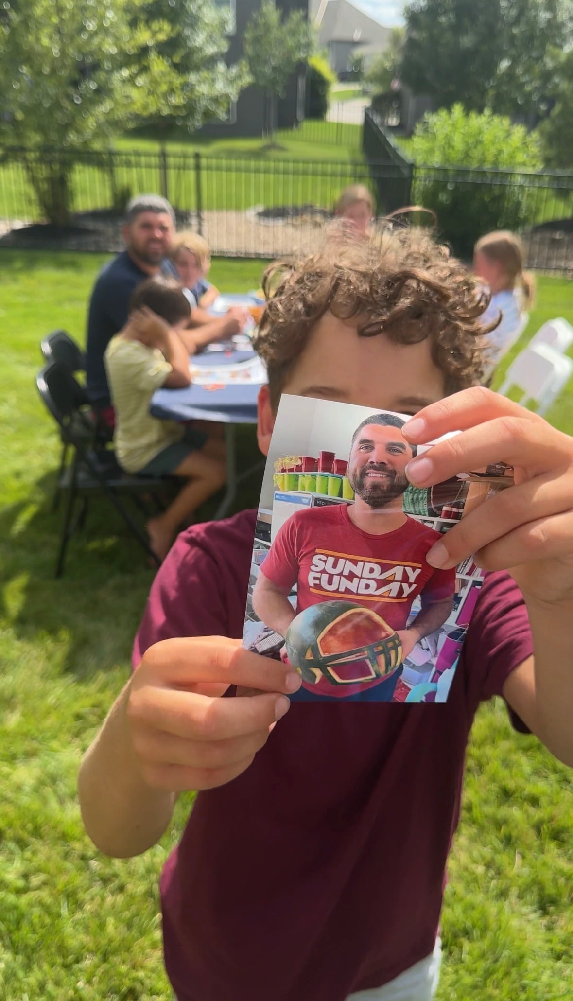 kid holding a picture of his dad