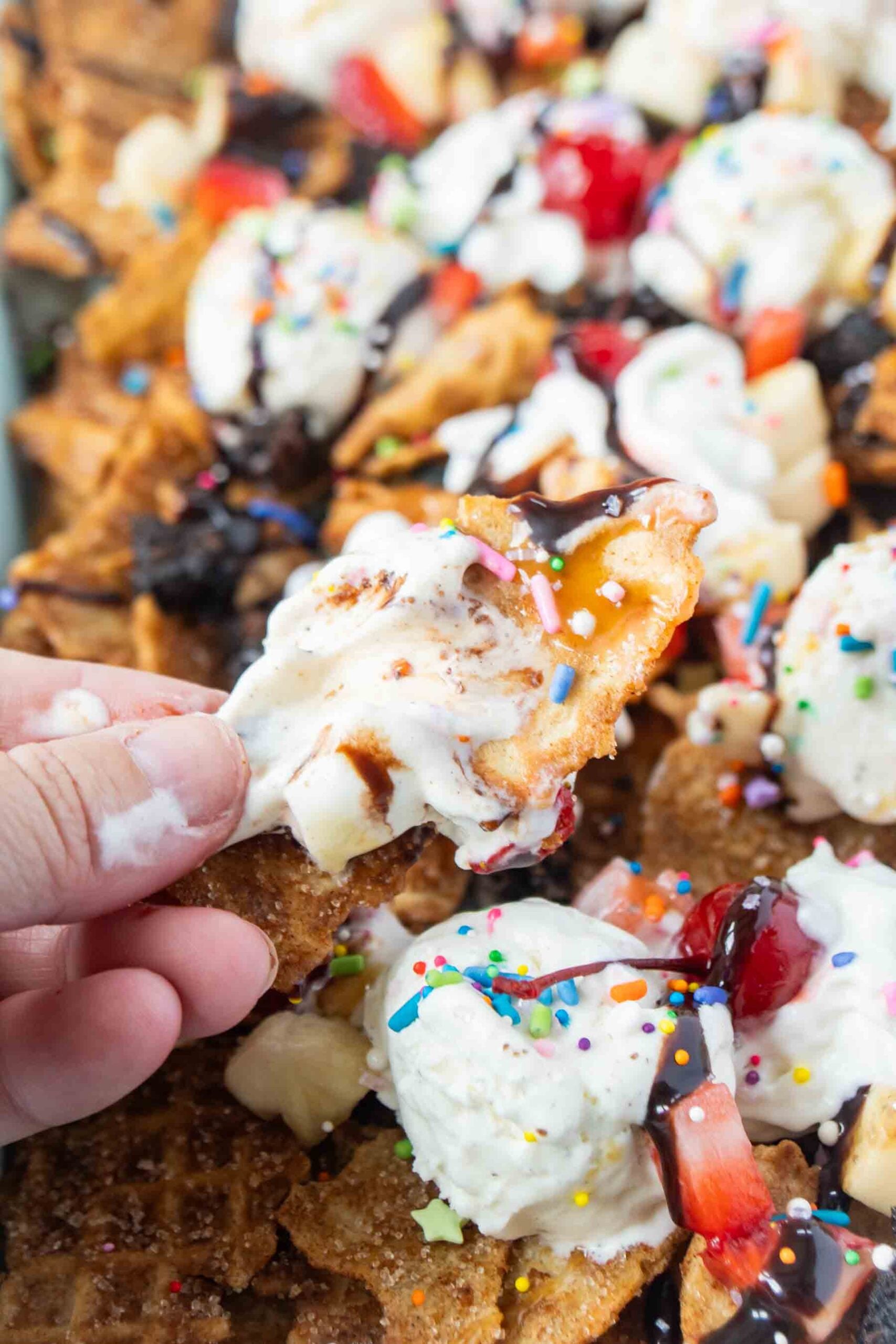 hand holding an ice cream nacho