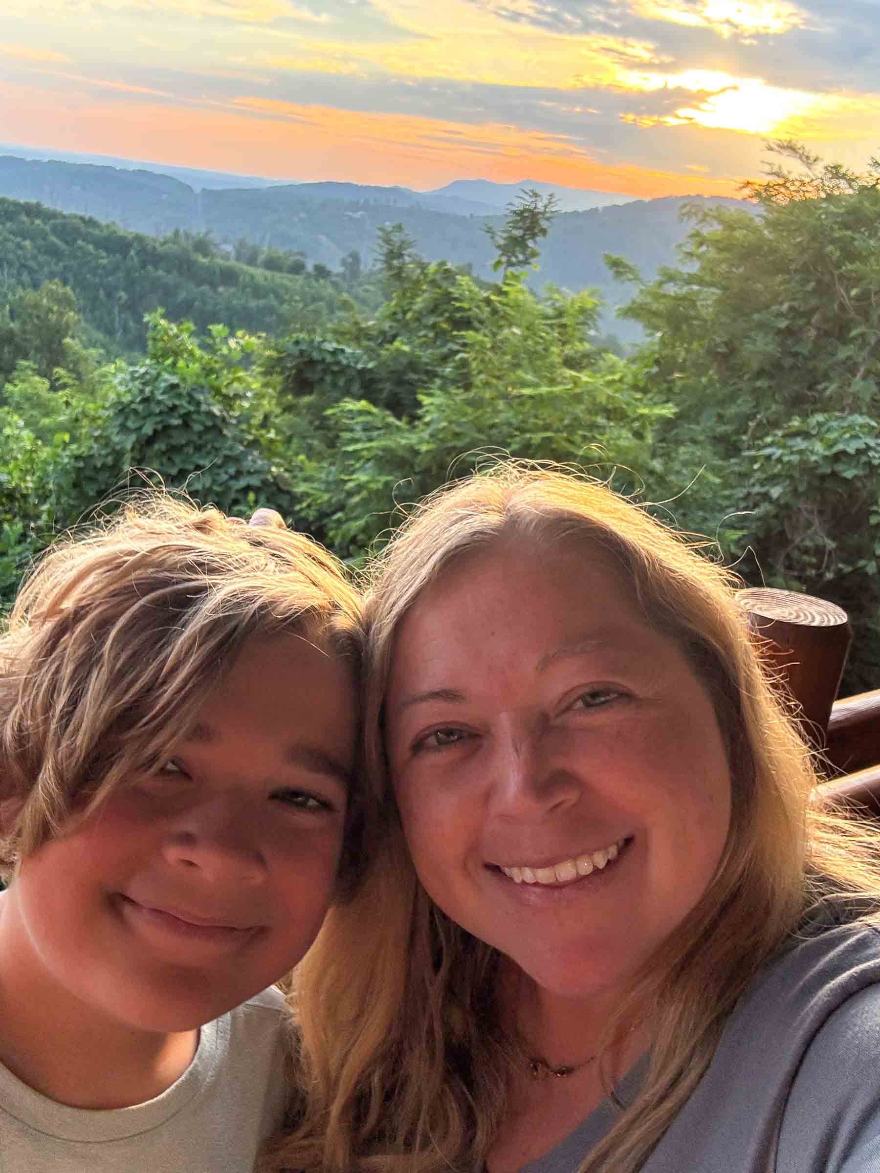 woman and teen boy in front of the mountains