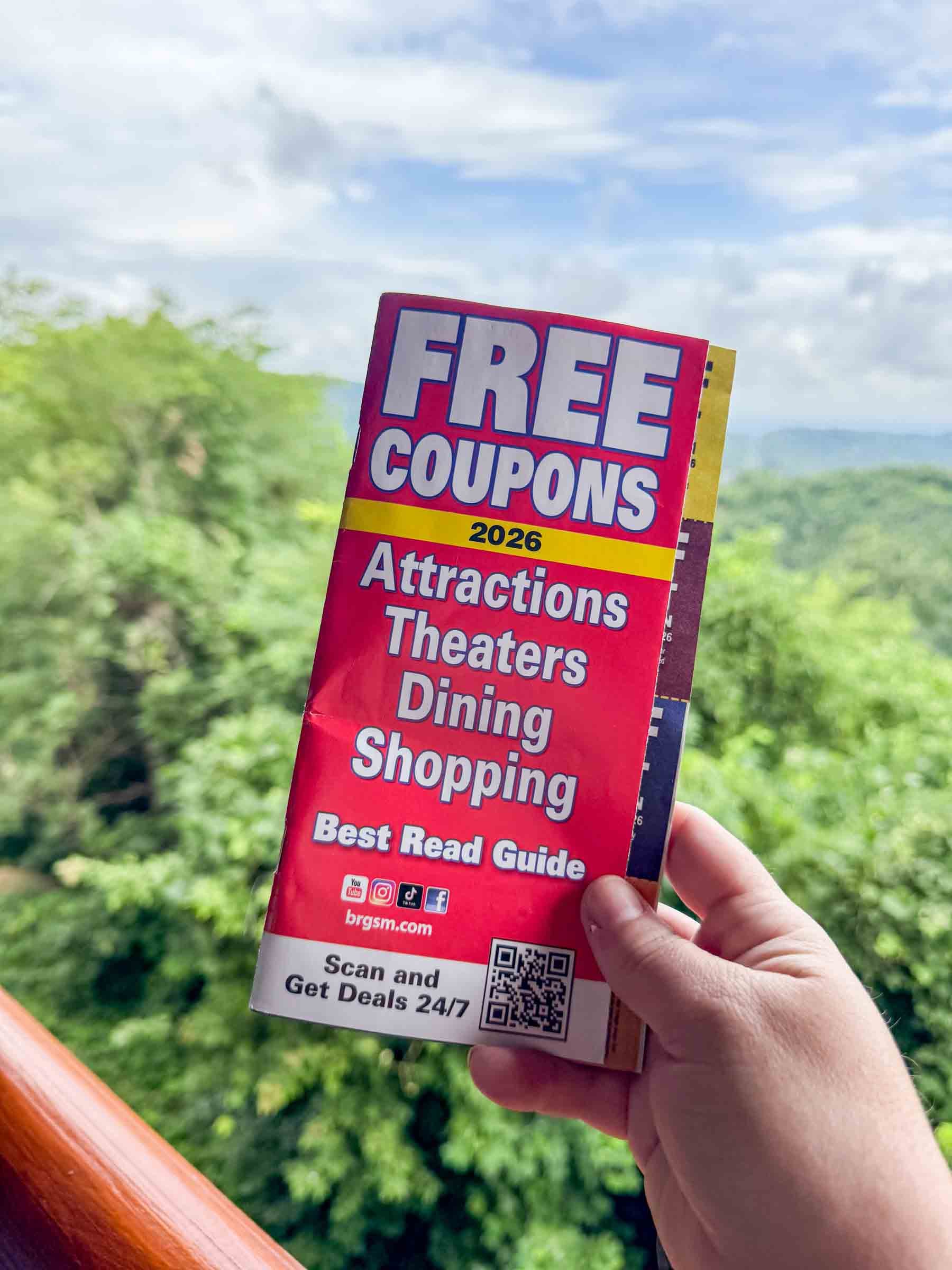hand holding a gatlinburg coupon guide